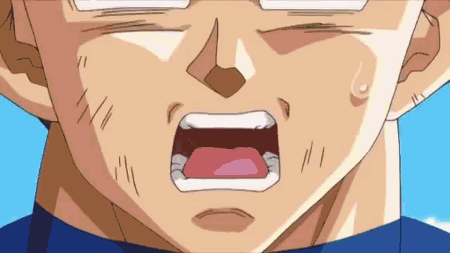 a close up of a person 's face with their mouth open