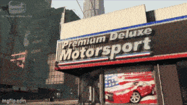 a premium deluxe motorsport store with a red car in front of it
