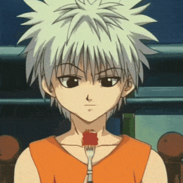 a young boy with white hair is holding a piece of food on a fork