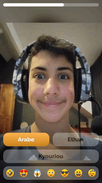 a young man wearing headphones with the name ethan on the bottom right