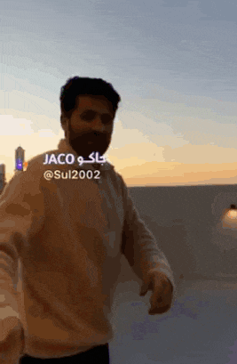 a man with a beard is wearing sunglasses and has the name jaco on his shirt