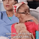 a woman and a little girl are sitting next to each other .