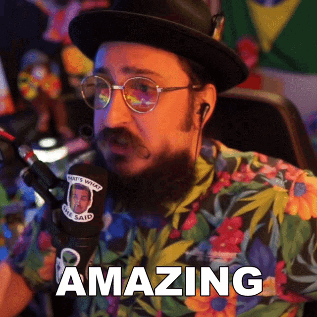 a man wearing glasses and a hat says amazing