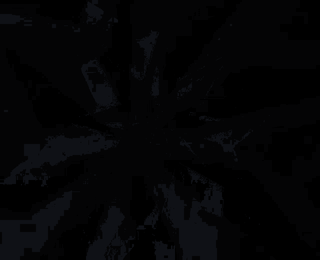 a close up of a silver star on a black surface .
