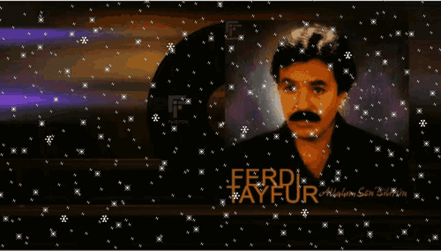 a picture of ferdi tayfur is surrounded by snow
