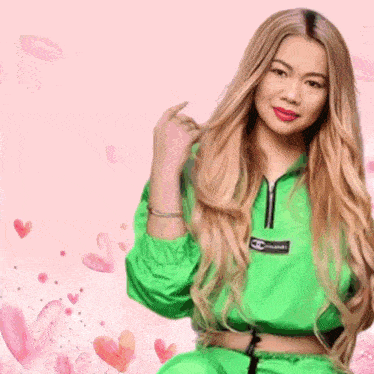 a woman wearing a green jacket with the word chanel on the front