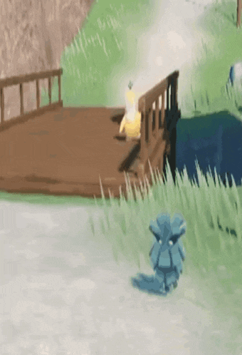 a blue statue is standing in the grass next to a bridge .
