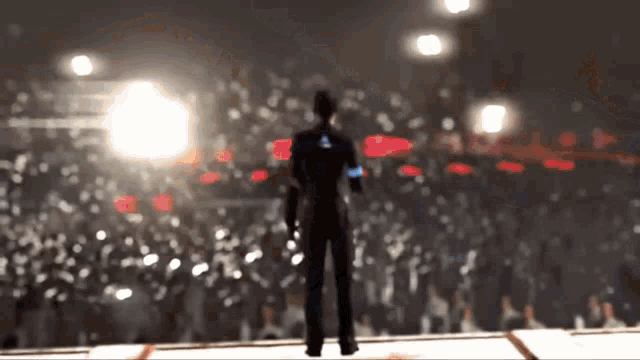 a blurry picture of a man standing on a stage