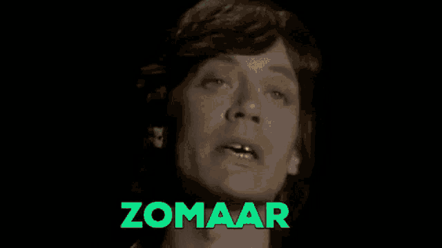 a black and white photo of a man with the word zomaar in green