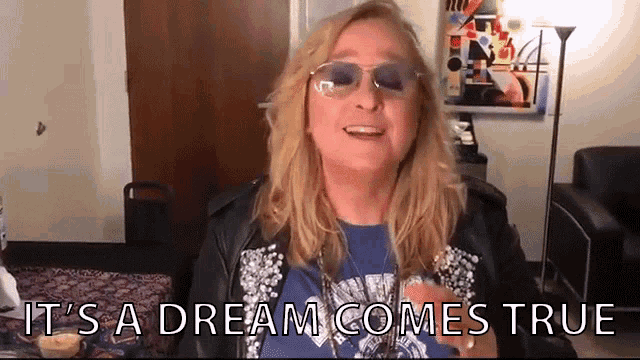a blonde woman wearing sunglasses and a blue shirt says it 's a dream comes true