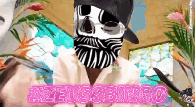 a man wearing a skull mask and a hat with the words #zeussbingo written on it