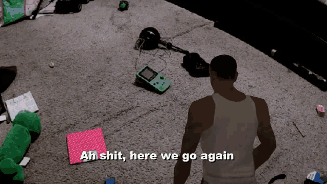 a man is standing in a messy room with the words ah shit here we go again