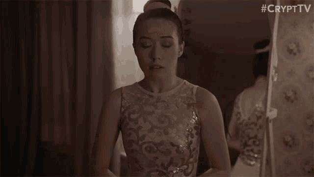 a person is walking through a doorway in a room .