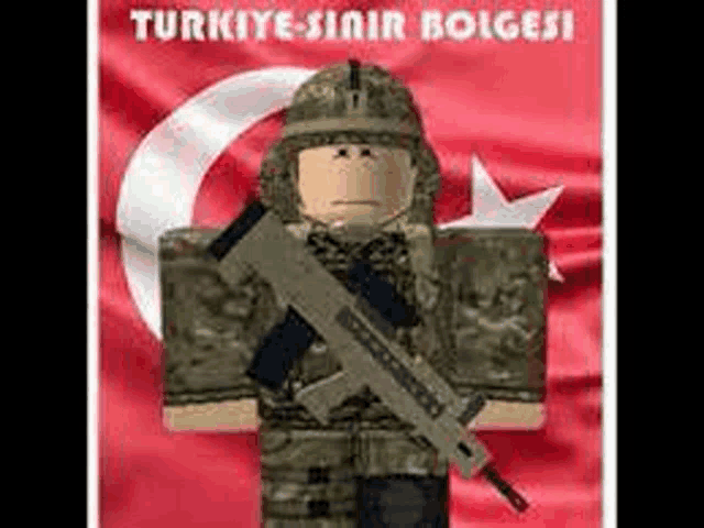 a soldier with a gun is standing in front of a flag .