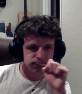 a man wearing headphones and a white shirt