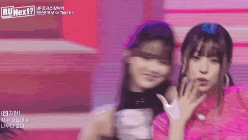two girls are standing next to each other on a stage with a sign that says ru next