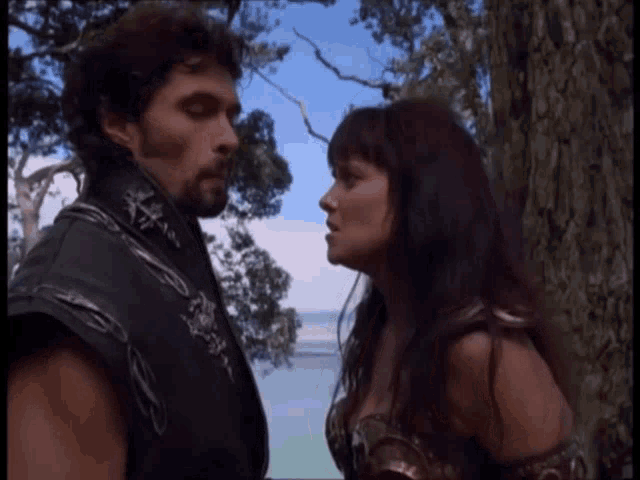 a man and a woman are looking into each others eyes