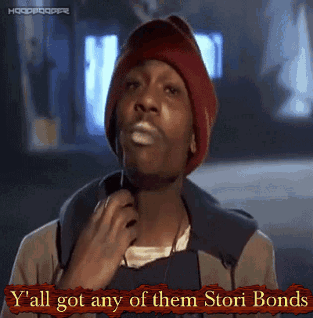 a man wearing a red beanie says y'all got any of them stori bonds