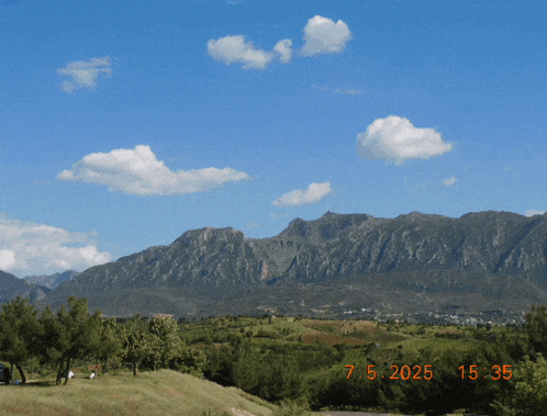 a photo of a mountain range taken on the 7th of may 2025