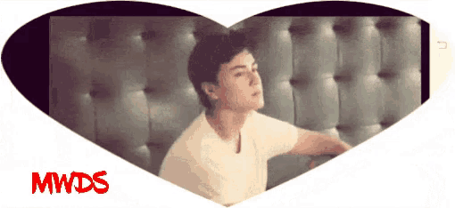 a man in a white shirt is in a heart shaped frame with mwds written in red