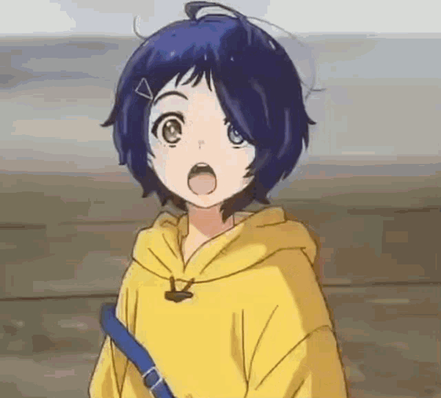 a girl with blue hair and a yellow hoodie is standing next to a wall .