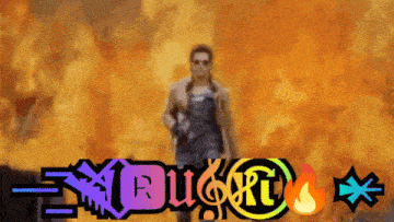 a man is standing in front of a fire with the word dugt written in the foreground