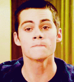a close up of a man 's face making a silly face