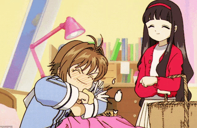 a girl in a red jacket is standing next to a girl in a blue shirt