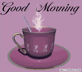 a purple cup with a spoon on a saucer with the words good morning written above it