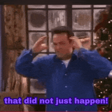 a man is standing in front of a christmas tree and saying that did not just happen .