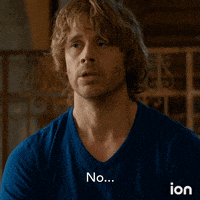 a man in a blue shirt with the word no on his shirt