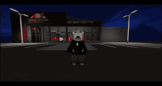 a girl stands in front of a greenfood organic store at night
