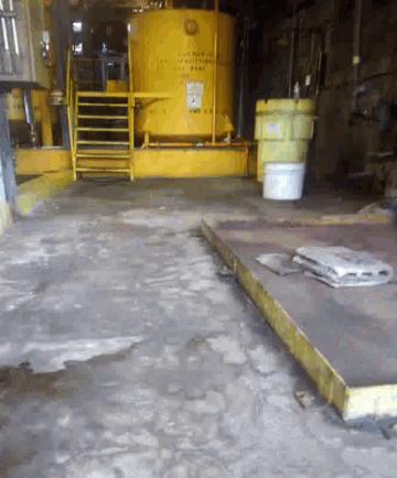 a yellow tank with a sign on it that says ' no smoking ' on it