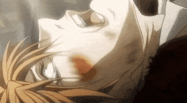 a close up of a man laying on his back with blood on his face .