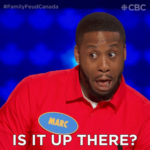 a man wearing a red shirt with a name tag that says marc is it up there