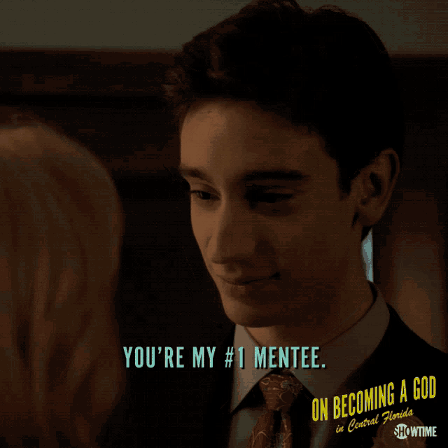 a man in a suit and tie says you 're my # 1 mentee on becoming a god in central florida