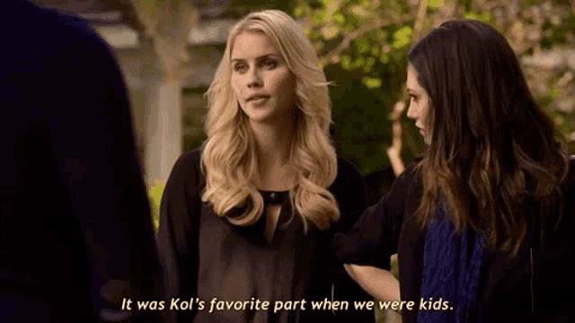 two women are standing next to each other with one saying it was kol 's favorite part when we were kids