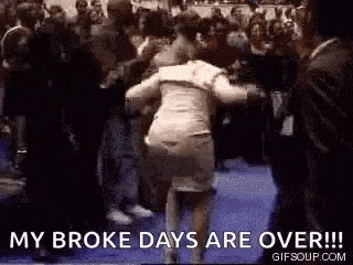 a woman is dancing in front of a crowd of people with the words `` my broke days are over ! ''