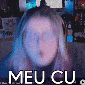 a woman 's face is obscured by the words meu cu on the screen