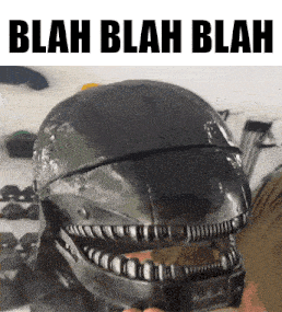 a person is holding a helmet that says blah blah blah on it