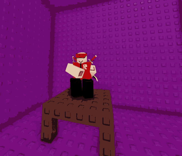 a person sitting on a table in a room with a purple wall