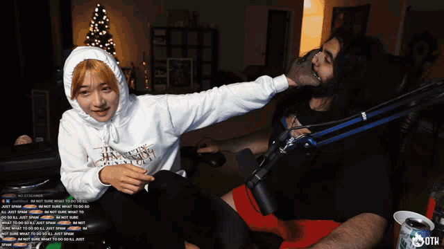 a woman wearing a white hoodie that says i 'm not sure what to do with