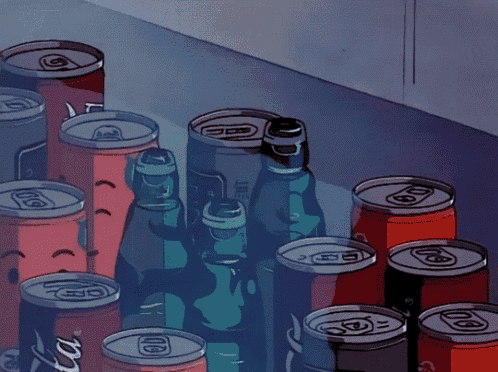 a hand is reaching for a can of soda that says coca cola on it
