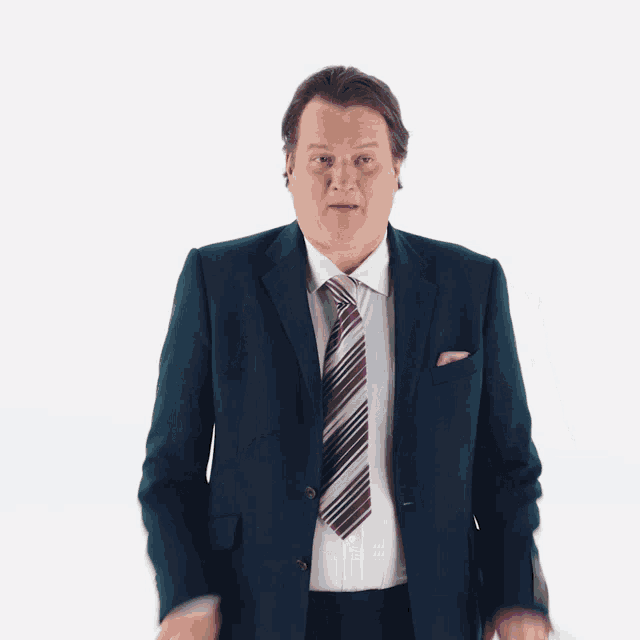 a man wearing a suit and tie is making a funny face