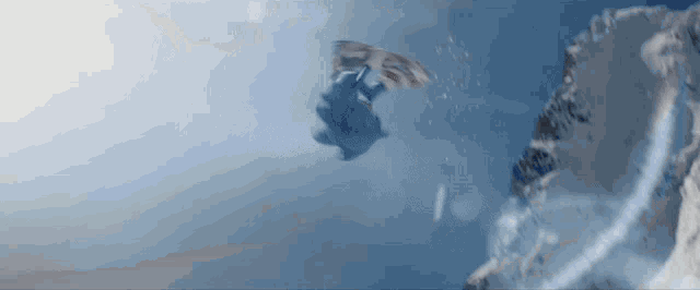 a person flying through the air with an american flag