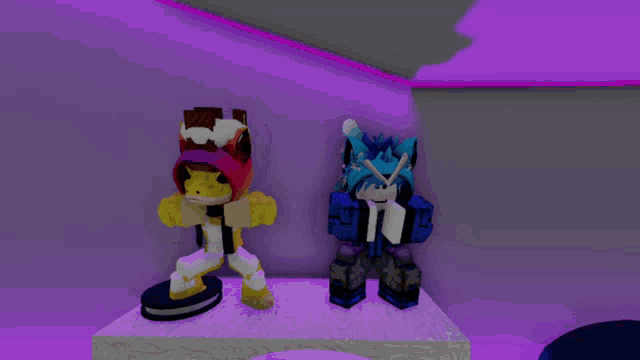 two cartoon characters standing next to each other on a table