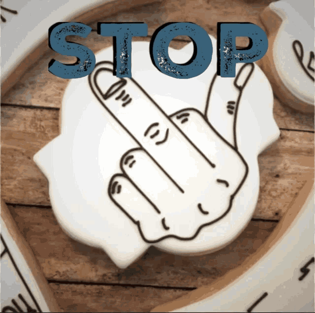 a drawing of a finger with the word stop written above it