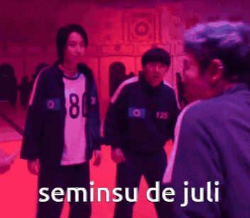 a group of people standing next to each other with the words seminsu de juli on the bottom right