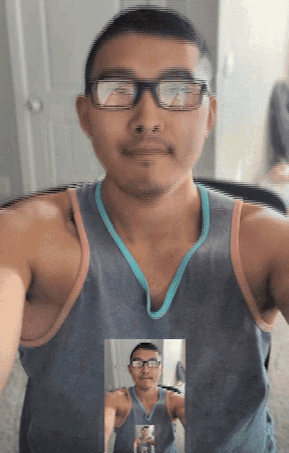 a man wearing glasses and a tank top is taking a selfie