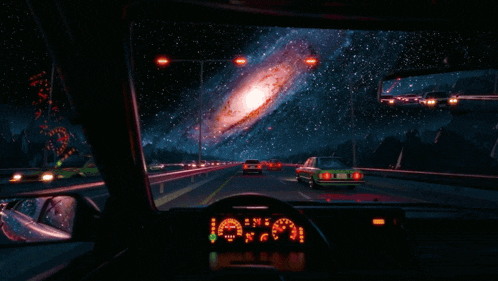 a car is driving down a highway at night with a galaxy in the sky